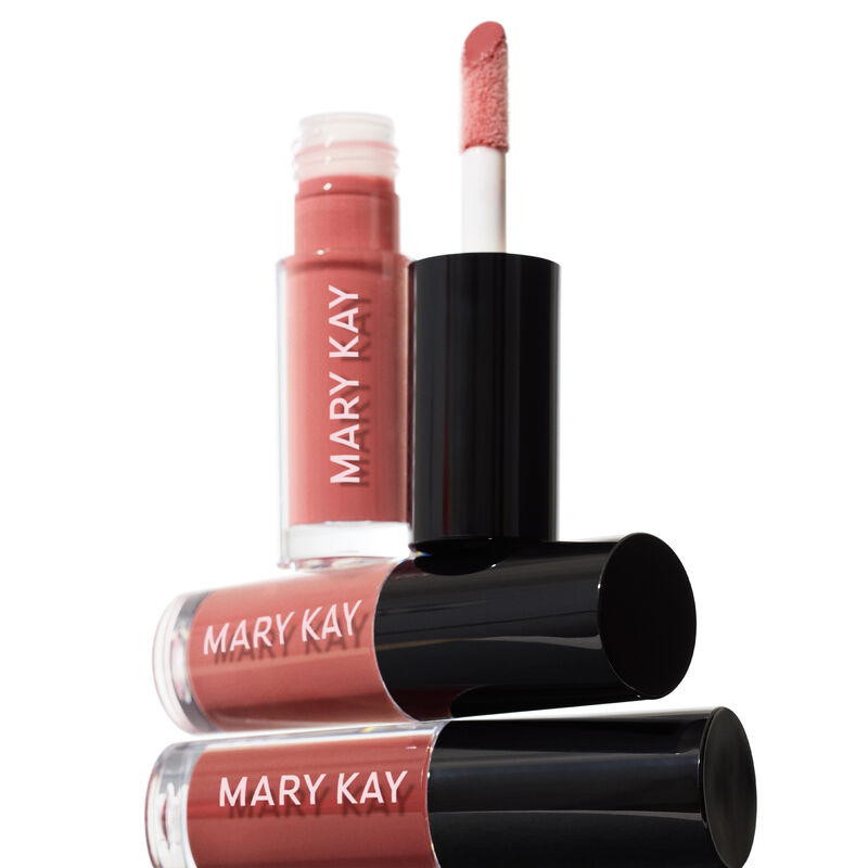 Horizontal stack of Mary Kay Tinted Lip Oil in Blush and Berry with an additional vertical uncapped tube of Mary Kay Tinted Lip Oil in Blush&nbsp;